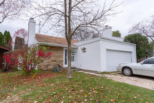 2S616 Linden Sq, Warrenville, IL 60555 - view of front of home with a chimney, stone siding, and an attached garage