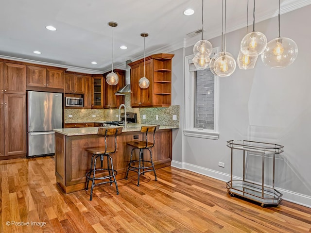 kitchen with hanging light fixtures, a peninsula, open shelves, brown cabinets, and stainless steel appliances