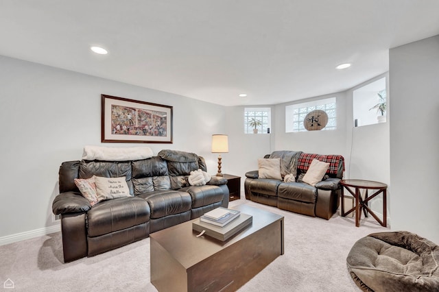 living area with light colored carpet, recessed lighting, and baseboards