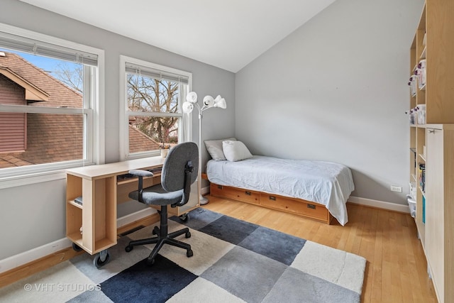 6927 N Oleander Ave, Chicago, IL 60631 - bedroom featuring lofted ceiling, wood finished floors, baseboards, and an office area