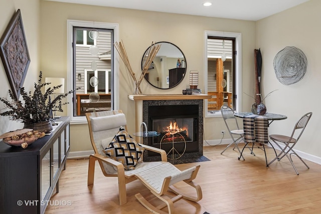 6927 N Oleander Ave, Chicago, IL 60631 - living area featuring light wood-style floors, a fireplace, baseboards, recessed lighting, and healthy amount of natural light