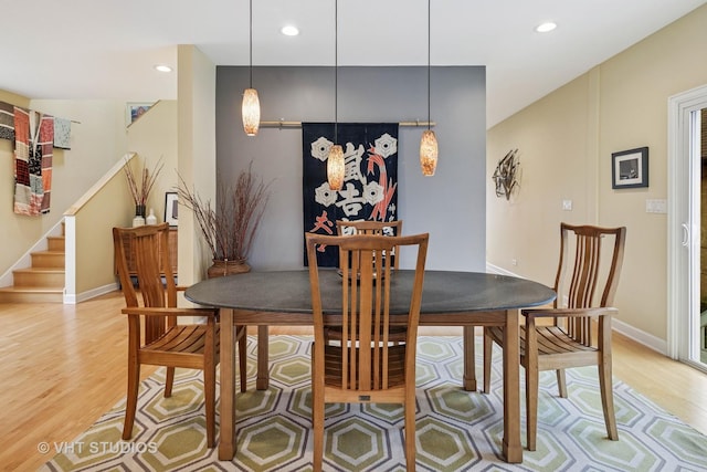 6927 N Oleander Ave, Chicago, IL 60631 - dining room featuring light wood-style flooring, baseboards, recessed lighting, and stairway
