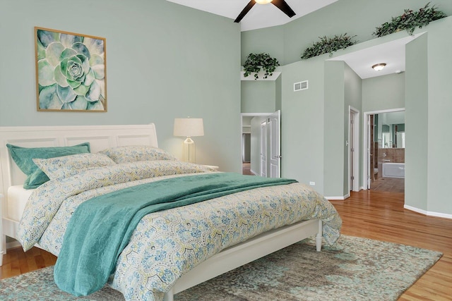 472 Linden Cir, Beecher, IL 60401 - bedroom with wood finished floors, baseboards, a towering ceiling, ceiling fan, and ensuite bathroom