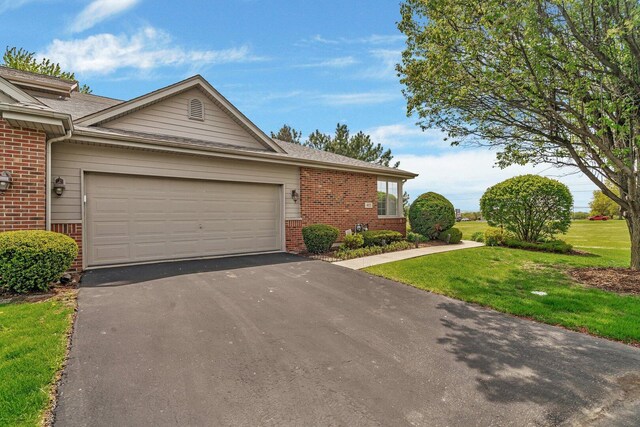 472 Linden Cir, Beecher, IL 60401 - ranch-style house with brick siding, driveway, a garage, and a front lawn