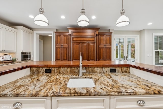 3324 Lakeside Ave, Northbrook, IL 60062 - kitchen featuring a sink, decorative light fixtures, light stone countertops, and recessed lighting
