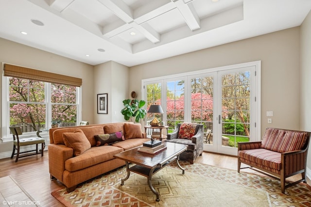 living room featuring coffered ceiling, wood finished floors, beamed ceiling, recessed lighting, and french doors