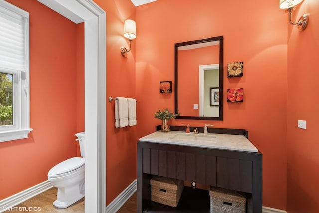 3324 Lakeside Ave, Northbrook, IL 60062 - bathroom featuring toilet, vanity, baseboards, and wood finished floors