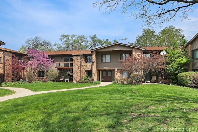 1132 E Randville Dr Unit 2E, Palatine, IL 60074 - view of front of property featuring a front yard and brick siding