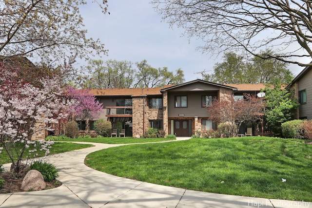 1132 E Randville Dr Unit 2E, Palatine, IL 60074 - view of front of house featuring a front lawn and brick siding