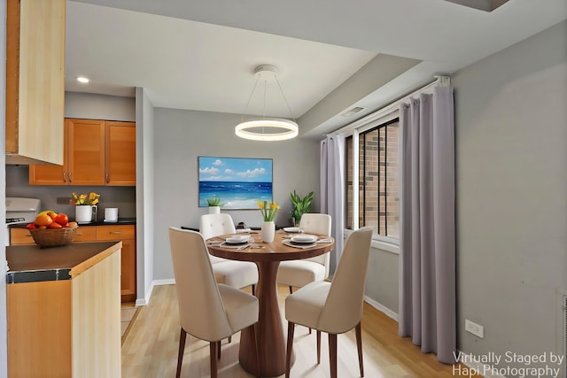 1132 E Randville Dr Unit 2E, Palatine, IL 60074 - dining space featuring light wood finished floors, baseboards, and visible vents