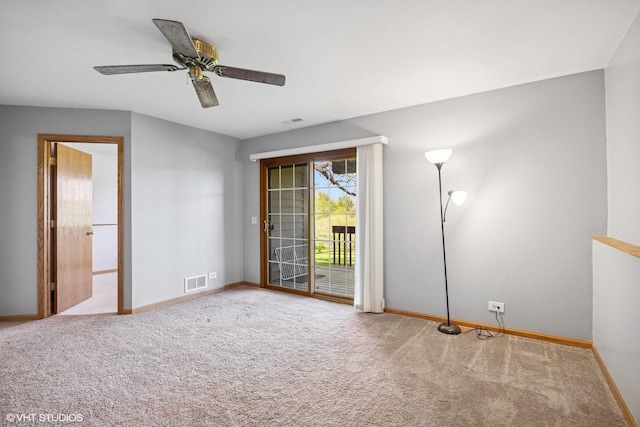 carpeted empty room with baseboards and ceiling fan