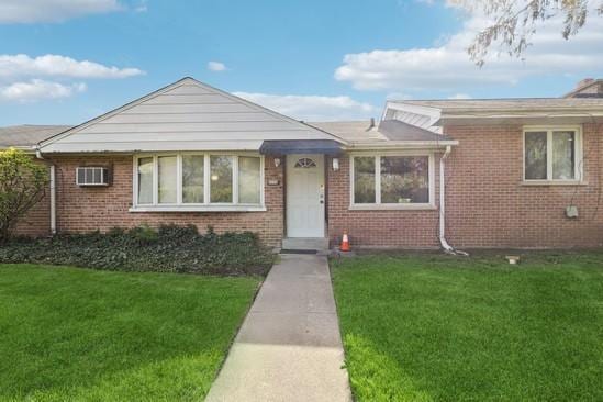 2104 S River Rd, Des Plaines, IL 60018 - view of front of house with a front lawn and brick siding