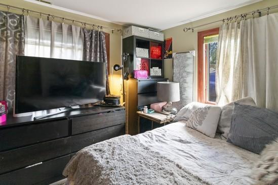 2104 S River Rd, Des Plaines, IL 60018 - bedroom featuring crown molding