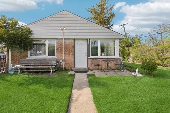 2104 S River Rd, Des Plaines, IL 60018 - view of front of house with brick siding and a front yard