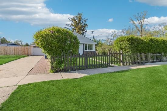 2104 S River Rd, Des Plaines, IL 60018 - view of side of property with concrete driveway and a garage