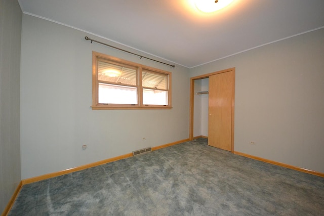 2820 S Shields Ave, Chicago, IL 60616 - unfurnished bedroom with baseboards, crown molding, a closet, and carpet flooring