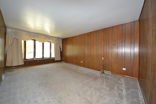 2820 S Shields Ave, Chicago, IL 60616 - carpeted empty room featuring wood walls