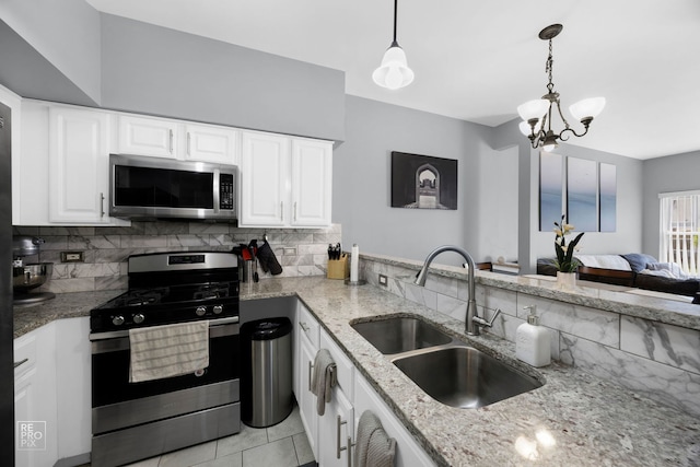 16526 S Nottingham Ct, Lockport, IL 60441 - kitchen featuring backsplash, appliances with stainless steel finishes, light stone countertops, and a sink