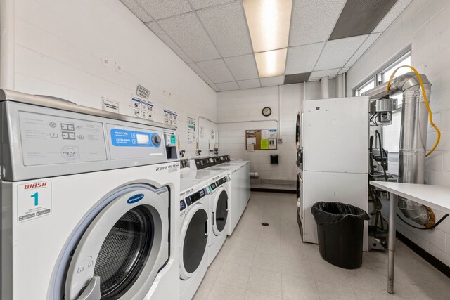 community laundry room with washing machine and clothes dryer