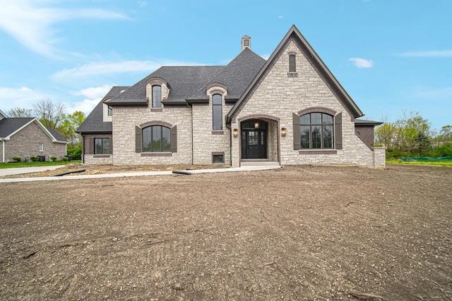 1212 Georgias Way, New Lenox, IL 60451 - french country style house with a shingled roof and stone siding