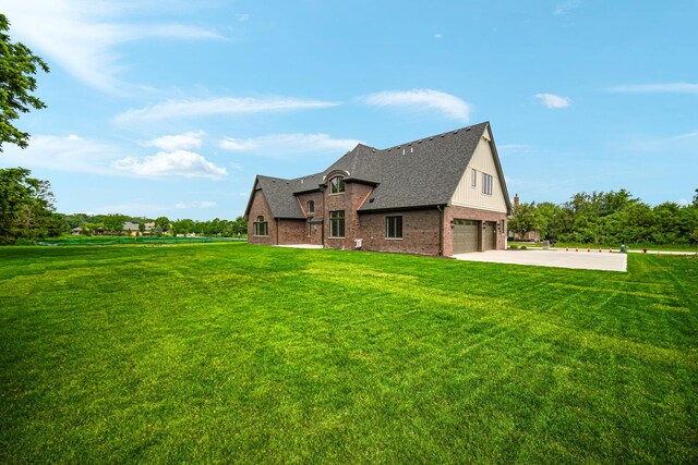 1212 Georgias Way, New Lenox, IL 60451 - view of home's exterior featuring board and batten siding, an attached garage, brick siding, and concrete driveway