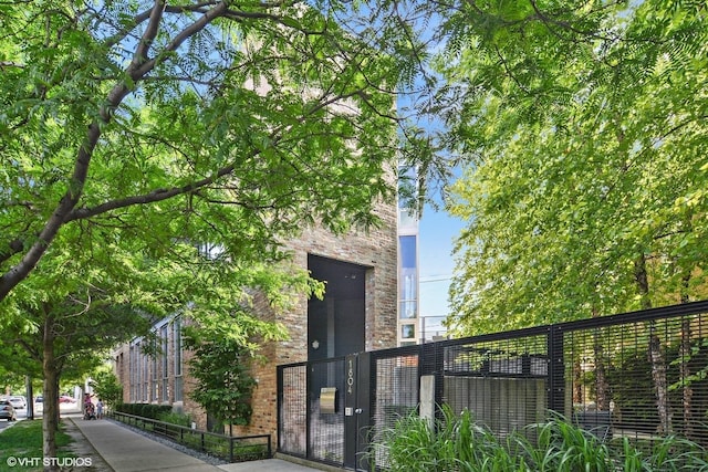 view of gate featuring a fenced front yard