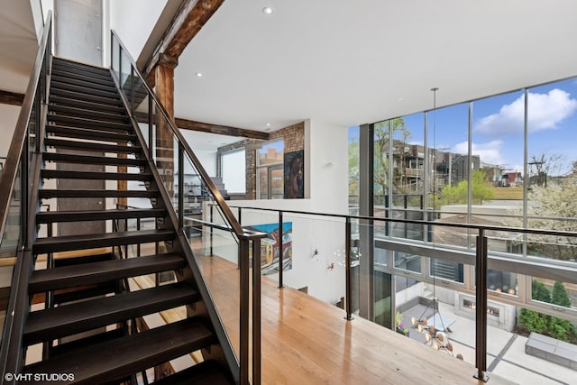 stairs with a wall of windows