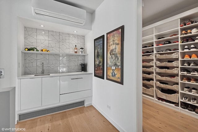 1804 N Leavitt St, Chicago, IL 60647 - bedroom featuring brick wall, wood finished floors, and baseboards