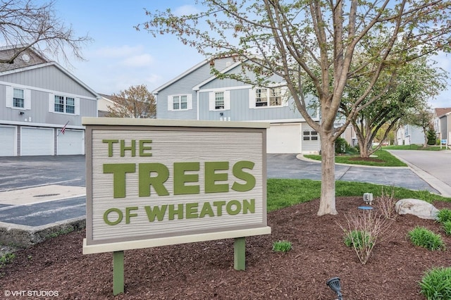 1387 Woodcutter Ln Unit D, Wheaton, IL 60189 - community sign featuring driveway and a garage