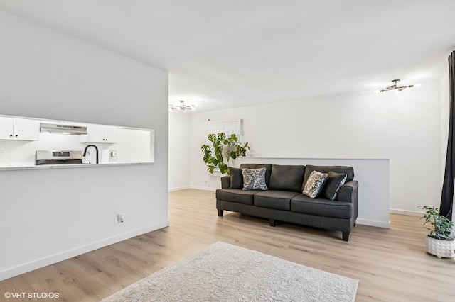 1387 Woodcutter Ln Unit D, Wheaton, IL 60189 - living room with light wood finished floors and baseboards