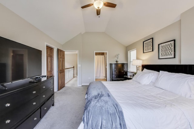 bedroom with light carpet, lofted ceiling, baseboards, and a ceiling fan