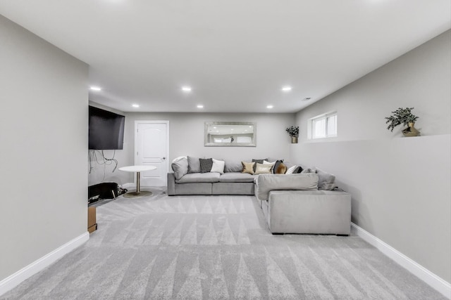 living area featuring carpet, baseboards, and recessed lighting