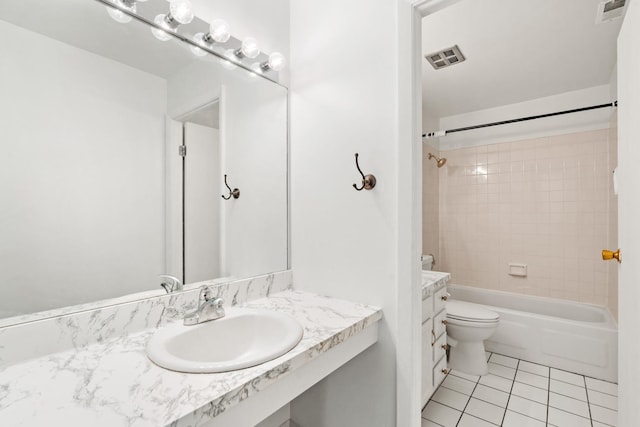 full bathroom featuring tile patterned floors, vanity, toilet, and bathing tub / shower combination