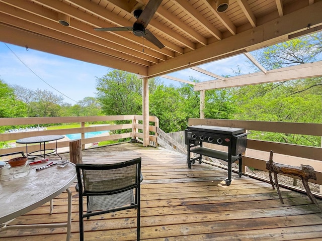 wooden deck featuring a ceiling fan