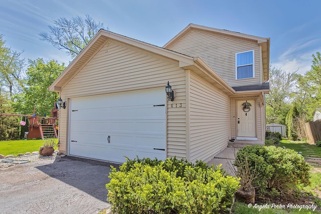 613 W Pheasant Ct, Round Lake Beach, IL 60073 - traditional-style home featuring asphalt driveway