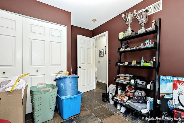 613 W Pheasant Ct, Round Lake Beach, IL 60073 - bedroom with a closet and dark stone finish floors