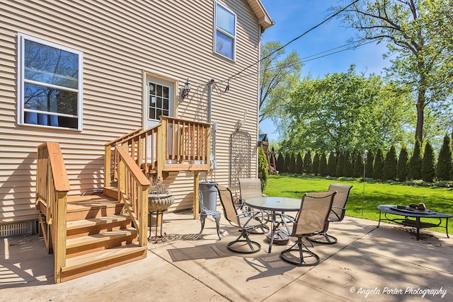 613 W Pheasant Ct, Round Lake Beach, IL 60073 - view of patio / terrace featuring outdoor dining area