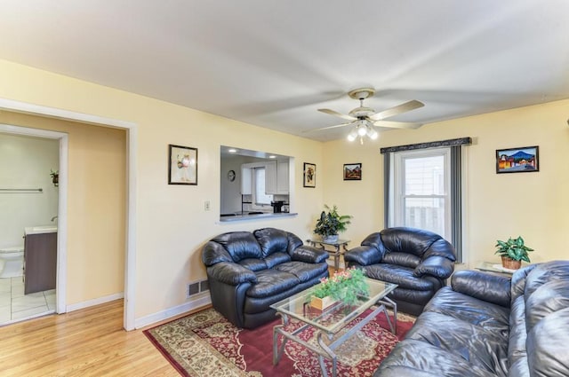 1431 N Hillside Ave, Berkeley, IL 60163 - living area featuring a ceiling fan, light wood finished floors, and baseboards