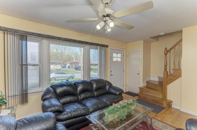1431 N Hillside Ave, Berkeley, IL 60163 - living area with wood finished floors, stairs, ceiling fan, and baseboards