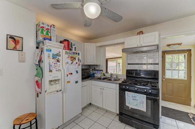 1431 N Hillside Ave, Berkeley, IL 60163 - kitchen with black appliances, a sink, under cabinet range hood, and light tile patterned floors