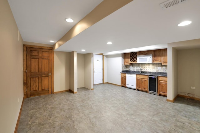 28W624 Berkshire Rd, West Chicago, IL 60185 - kitchen with white appliances, wine cooler, dark countertops, a sink, and backsplash