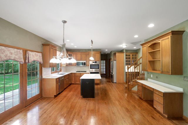 28W624 Berkshire Rd, West Chicago, IL 60185 - kitchen with stainless steel appliances, a sink, a center island, open shelves, and light countertops