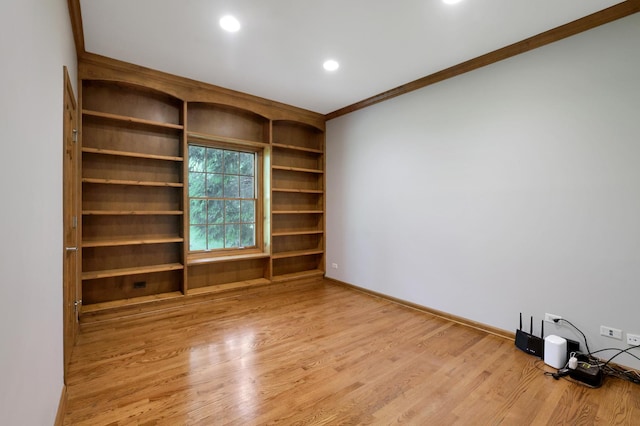 28W624 Berkshire Rd, West Chicago, IL 60185 - spare room with crown molding, wood finished floors, built in shelves, baseboards, and recessed lighting