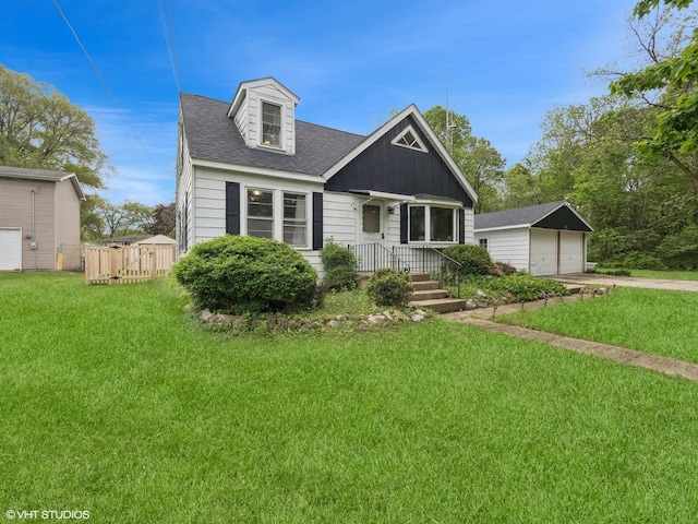 1345 Winaki Trl, Algonquin, IL 60102 - view of front of home with a detached garage, an outbuilding, a front lawn, and roof with shingles