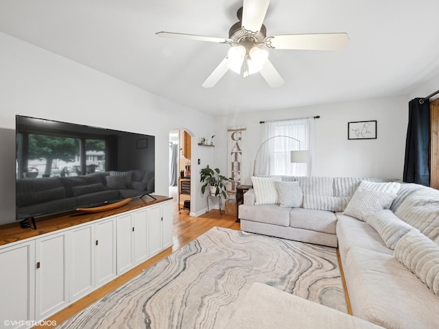 1345 Winaki Trl, Algonquin, IL 60102 - living area featuring arched walkways, ceiling fan, and light wood-style flooring