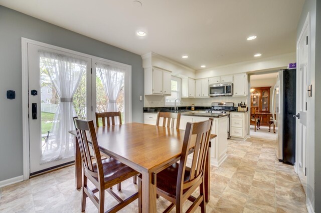 dining space with recessed lighting