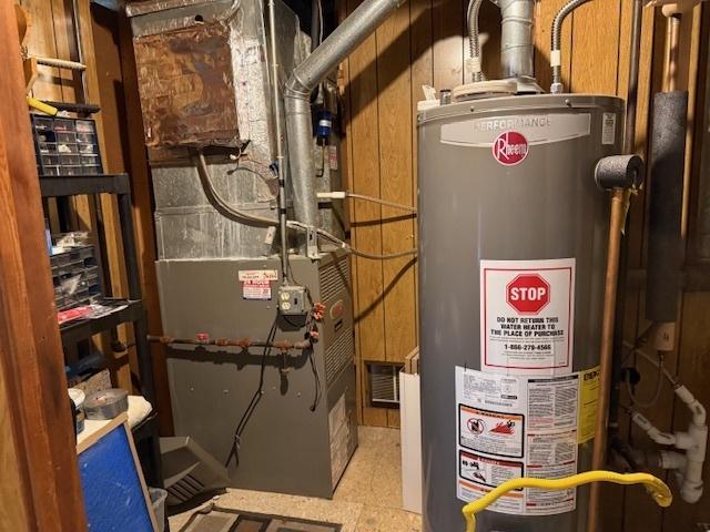 utilities featuring water heater and heating unit