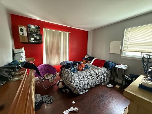 bedroom with wood finished floors