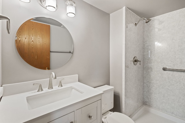 full bathroom with walk in shower, vanity, and toilet