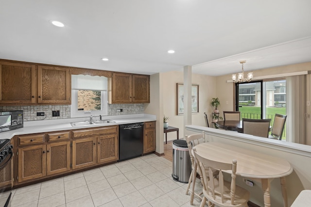 kitchen featuring brown cabinets, a sink, black appliances, a chandelier, and tasteful backsplash